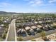 Scenic aerial view of a residential neighborhood with mountain views and well-maintained streets at 511 Dalgreen Pl, Henderson, NV 89012