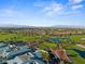 Panoramic aerial view of a community, including the golf course, ponds and community buildings at 511 Dalgreen Pl, Henderson, NV 89012