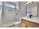 Contemporary bathroom with a stand-up shower, neutral tile, and a modern vanity at 511 Dalgreen Pl, Henderson, NV 89012