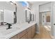 Elegant bathroom with double vanity, quartz countertop, and modern lighting at 511 Dalgreen Pl, Henderson, NV 89012