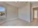 Bedroom with light wood floors, large windows, and a closet with sliding doors at 511 Dalgreen Pl, Henderson, NV 89012