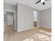 Bright bedroom with ensuite bathroom and light wood flooring at 511 Dalgreen Pl, Henderson, NV 89012