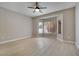 Bright bedroom with natural light, a ceiling fan, and large windows at 511 Dalgreen Pl, Henderson, NV 89012