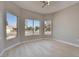 Corner room with multiple bright windows and light wood flooring at 511 Dalgreen Pl, Henderson, NV 89012