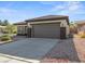 Single-story home with brown garage door at 511 Dalgreen Pl, Henderson, NV 89012