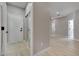 Hallway with light colored wood floors and doors leads to other rooms at 511 Dalgreen Pl, Henderson, NV 89012