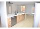 Kitchen island with sink, dishwasher and view into living room at 511 Dalgreen Pl, Henderson, NV 89012