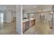 Island kitchen and dining area features wood floors and stainless steel appliances at 511 Dalgreen Pl, Henderson, NV 89012