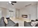 Light-filled living room featuring a modern fireplace and neutral décor at 511 Dalgreen Pl, Henderson, NV 89012