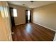 Simple bedroom with wood-look floors and two windows at 529 Beckton Park Ave, Las Vegas, NV 89178