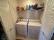 Laundry room with washer, dryer, and shelving at 529 Beckton Park Ave, Las Vegas, NV 89178