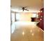 Spacious living room featuring tile floors and a ceiling fan at 529 Beckton Park Ave, Las Vegas, NV 89178