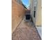 Side yard with gravel and AC unit at 529 Beckton Park Ave, Las Vegas, NV 89178