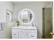 Bright bathroom boasts a modern vanity, large mirror, and a walk-in shower at 6008 Carmel Way, Las Vegas, NV 89108