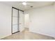 Well-lit bedroom featuring sliding closet doors and additional storage at 6008 Carmel Way, Las Vegas, NV 89108