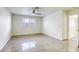 Well-lit bedroom featuring tile floors and a ceiling fan at 6008 Carmel Way, Las Vegas, NV 89108