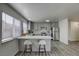 Modern gray kitchen with quartz countertops and stainless steel appliances at 6008 Carmel Way, Las Vegas, NV 89108