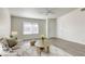 Spacious living room with hardwood floors, a neutral color palette, and ceiling fan at 6008 Carmel Way, Las Vegas, NV 89108