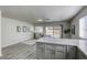 Bright living room with wood-look floors and access to the backyard at 6008 Carmel Way, Las Vegas, NV 89108