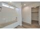 Clean bathroom with a bathtub and linen closet at 6217 Red Jamboree Ct, Las Vegas, NV 89130