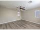 Bright bedroom featuring hardwood floors and ceiling fan at 6217 Red Jamboree Ct, Las Vegas, NV 89130