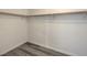 Large walk-in closet with wood shelving and gray flooring at 6217 Red Jamboree Ct, Las Vegas, NV 89130