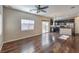 Living room with hardwood floors and kitchen view at 6217 Red Jamboree Ct, Las Vegas, NV 89130