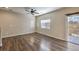 Living room with hardwood floors and sliding door at 6217 Red Jamboree Ct, Las Vegas, NV 89130