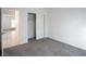 Bright bedroom with grey carpet and a spacious closet at 671 Anemone Ln, Henderson, NV 89015