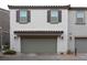 Two-car garage with attached storage at 671 Anemone Ln, Henderson, NV 89015