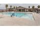 Community pool with accessibility ramp and lounge chairs at 671 Anemone Ln, Henderson, NV 89015