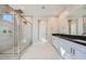 Bathroom featuring double sink vanity and glass shower with shower head at 6834 Compass St, North Las Vegas, NV 89084