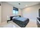 Cozy bedroom with a large window and a modern bed with a unique headboard at 6834 Compass St, North Las Vegas, NV 89084