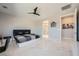 Bedroom featuring a platform bed, modern ceiling fan and ensuite bathroom at 6834 Compass St, North Las Vegas, NV 89084