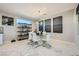 Bright dining room featuring a glass table and modern chairs at 6834 Compass St, North Las Vegas, NV 89084