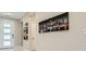 Modern entryway featuring unique door and cityscape artwork at 6834 Compass St, North Las Vegas, NV 89084