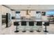 Spacious kitchen with stainless steel appliances, a large island, and modern white cabinetry at 6834 Compass St, North Las Vegas, NV 89084