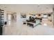 Open-concept living space features marble floors and a modern kitchen and living area at 6834 Compass St, North Las Vegas, NV 89084