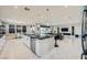 Open-concept living space features marble floors and a modern kitchen and living area at 6834 Compass St, North Las Vegas, NV 89084