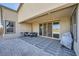 Covered patio with pavers, seating area, and grill at 6834 Compass St, North Las Vegas, NV 89084