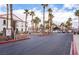 Gated community entrance with palm trees and landscaping at 700 Carnegie St # 2914, Henderson, NV 89052