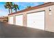 White garage doors in a well-lit parking area at 700 Carnegie St # 2914, Henderson, NV 89052