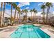 Relaxing community pool with surrounding lounge chairs at 700 Carnegie St # 2914, Henderson, NV 89052