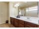 Primary bathroom with double sink vanity and large mirror at 8467 Bismark Sapphire St, Las Vegas, NV 89139