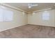 Bright bedroom with neutral carpeting and ceiling fan at 8467 Bismark Sapphire St, Las Vegas, NV 89139