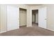 Bedroom with double door closet and access to hallway at 8467 Bismark Sapphire St, Las Vegas, NV 89139