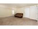 Gathering room with carpet, and a door leading to the upper level at 8467 Bismark Sapphire St, Las Vegas, NV 89139