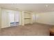 Gathering room with carpet, sliding door, and built-in shelving at 8467 Bismark Sapphire St, Las Vegas, NV 89139