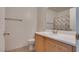 Simple bathroom with wood cabinets and shower/tub combo at 8627 Roping Rodeo Ave # 103, Las Vegas, NV 89178