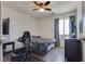 Bedroom with a bed, desk, and gaming chair at 8627 Roping Rodeo Ave # 103, Las Vegas, NV 89178